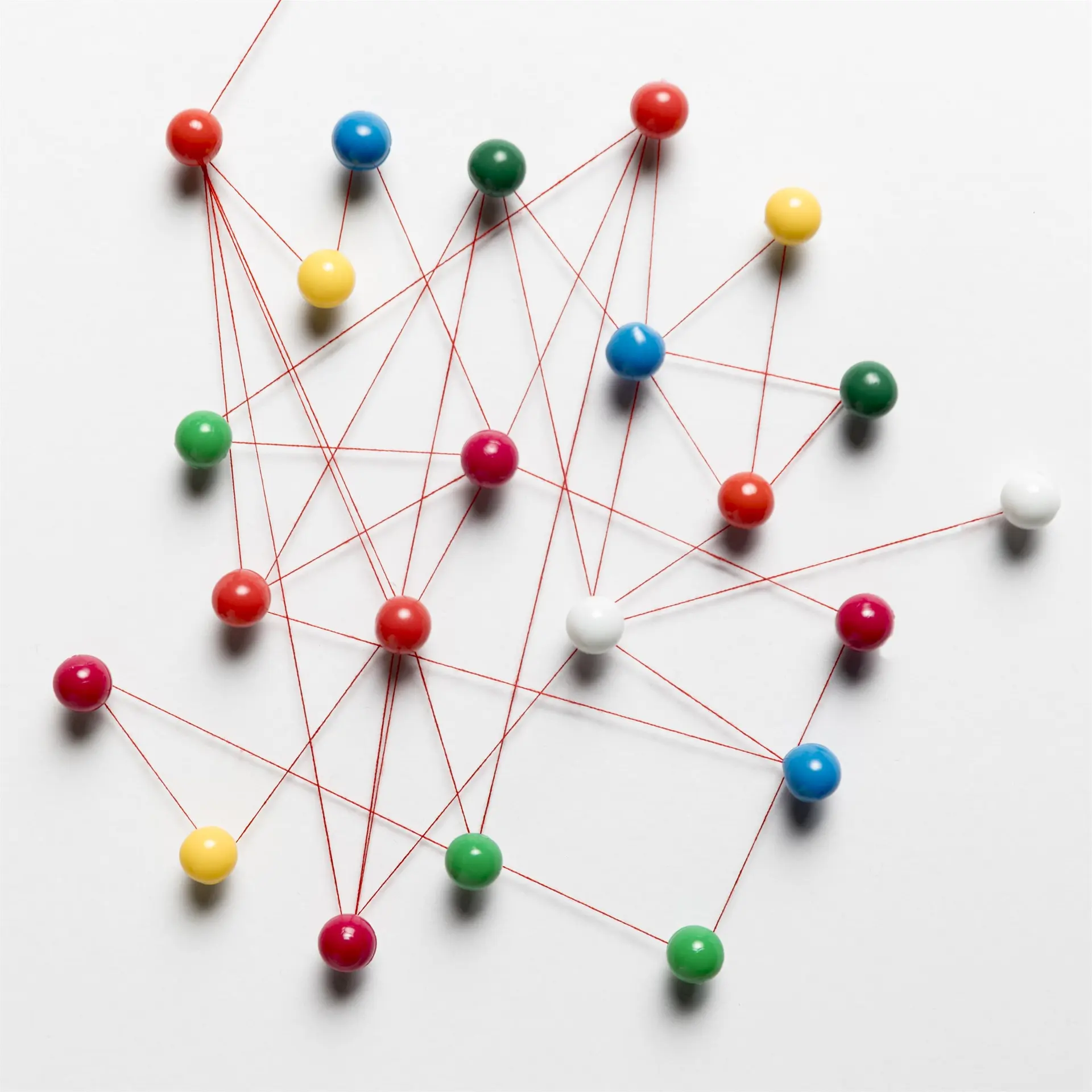 Connected pushpins representing client relationships, coordinated service delivery and remote business reach.